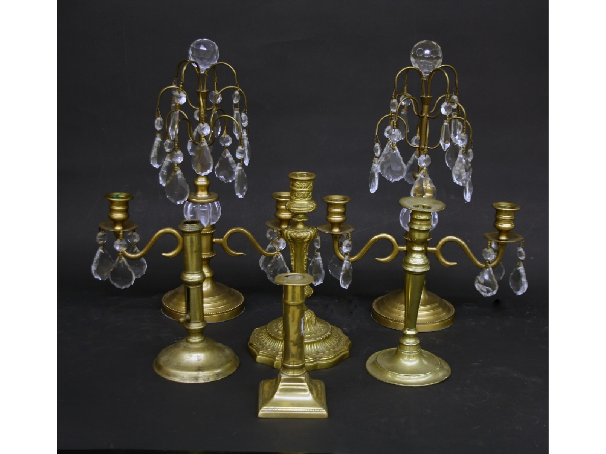 Appraisal: Pair of twin branch brass candelabra with prismatic lustre drops