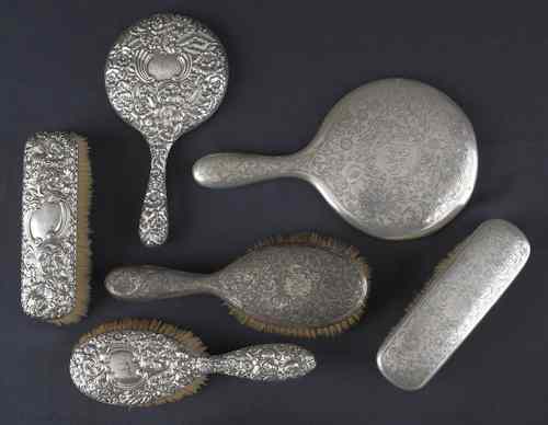 Appraisal: Four silver mounted brushes together with two hand mirrors