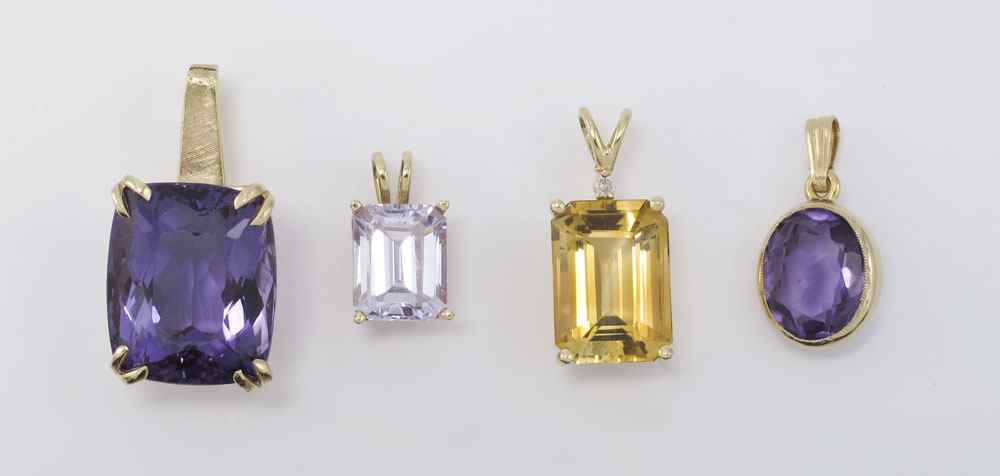 Appraisal: GEMSTONE PENDANTS Group of four K yellow gold pendants Two