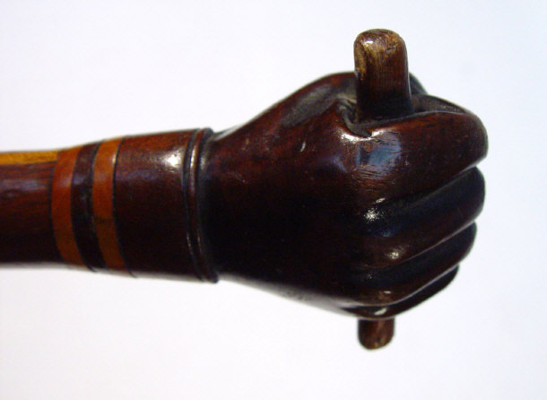 Appraisal: Victorian walking cane with fist and scroll carved handle