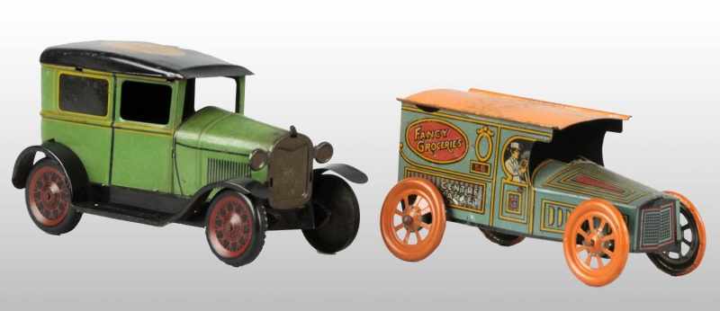 Appraisal: Lot of Tin Car Push Toys Description American Circa Includes