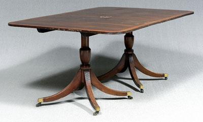 Appraisal: Regency style dining table two pedestals with tilting banded mahogany