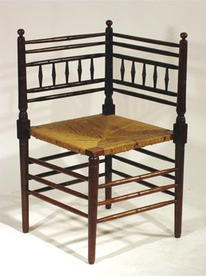 Appraisal: An Arts and Crafts Sussex oak corner chair probably retailed