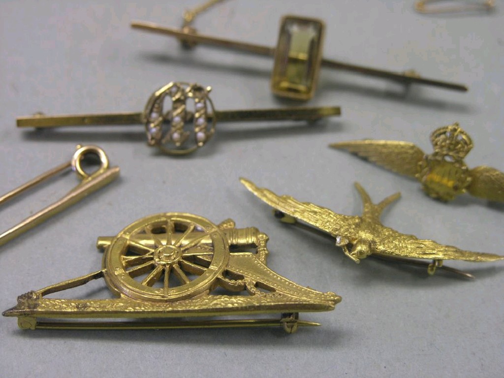 Appraisal: A ct gold RAF brooch a ct gold bird brooch