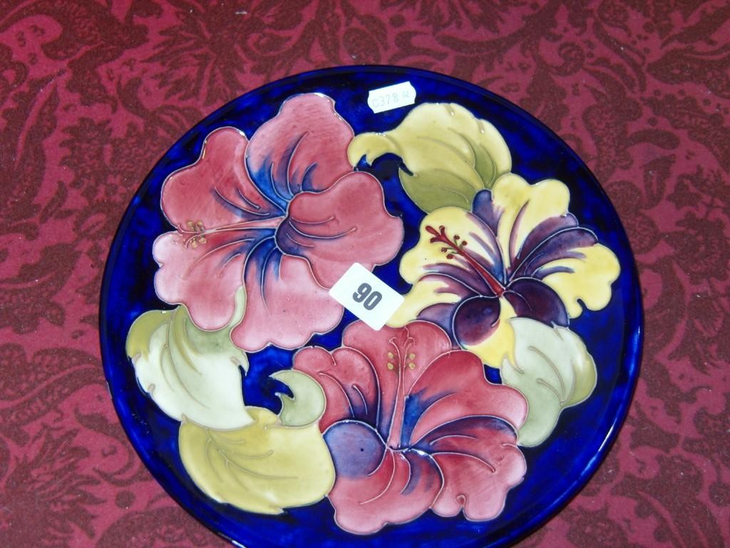 Appraisal: A blue ground Moorcroft plate of circular form with painted