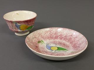 Appraisal: Red spatterware pea fowl cup and saucer diameter