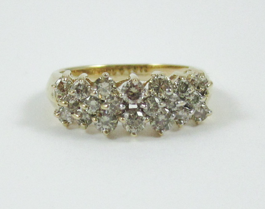 Appraisal: DIAMOND AND TEN KARAT YELLOW GOLD RING set with round-cut