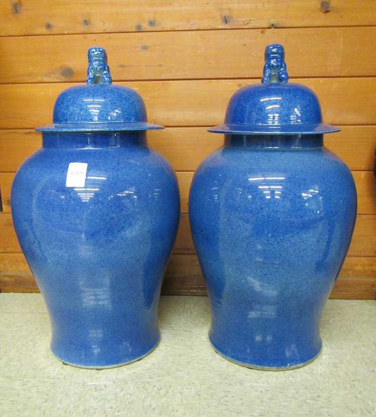 Appraisal: A PAIR OF CHINESE PORCELAIN COVERED TEMPLE JARS stippled blue