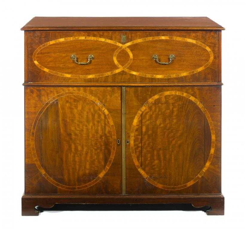 Appraisal: A GEORGE III MAHOGANY CHEST the secretaire drawer and pair