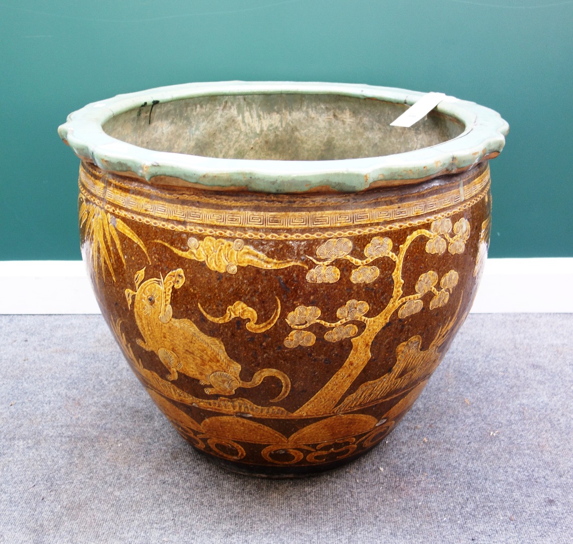 Appraisal: An Asian glazed stoneware jardiniere th century with foliate rim