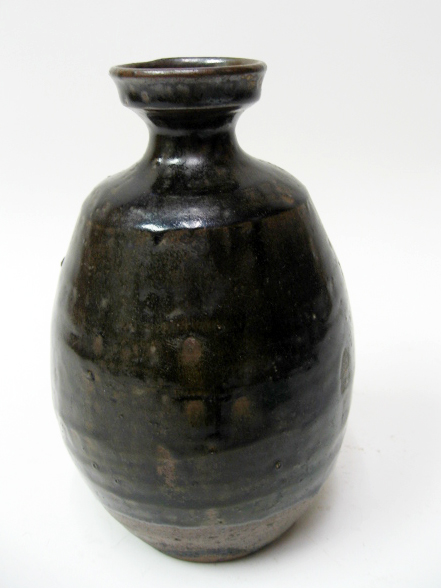 Appraisal: An Early Japanese Pottery Vase having a gallery rim narrow