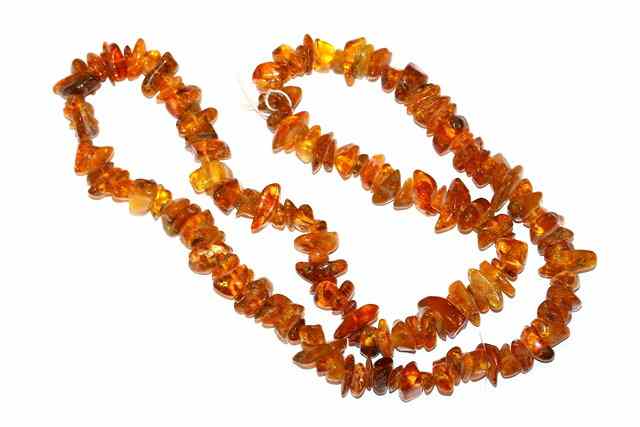 Appraisal: A NATURAL AMBER NECKLACE of interspersed bead form approximately long