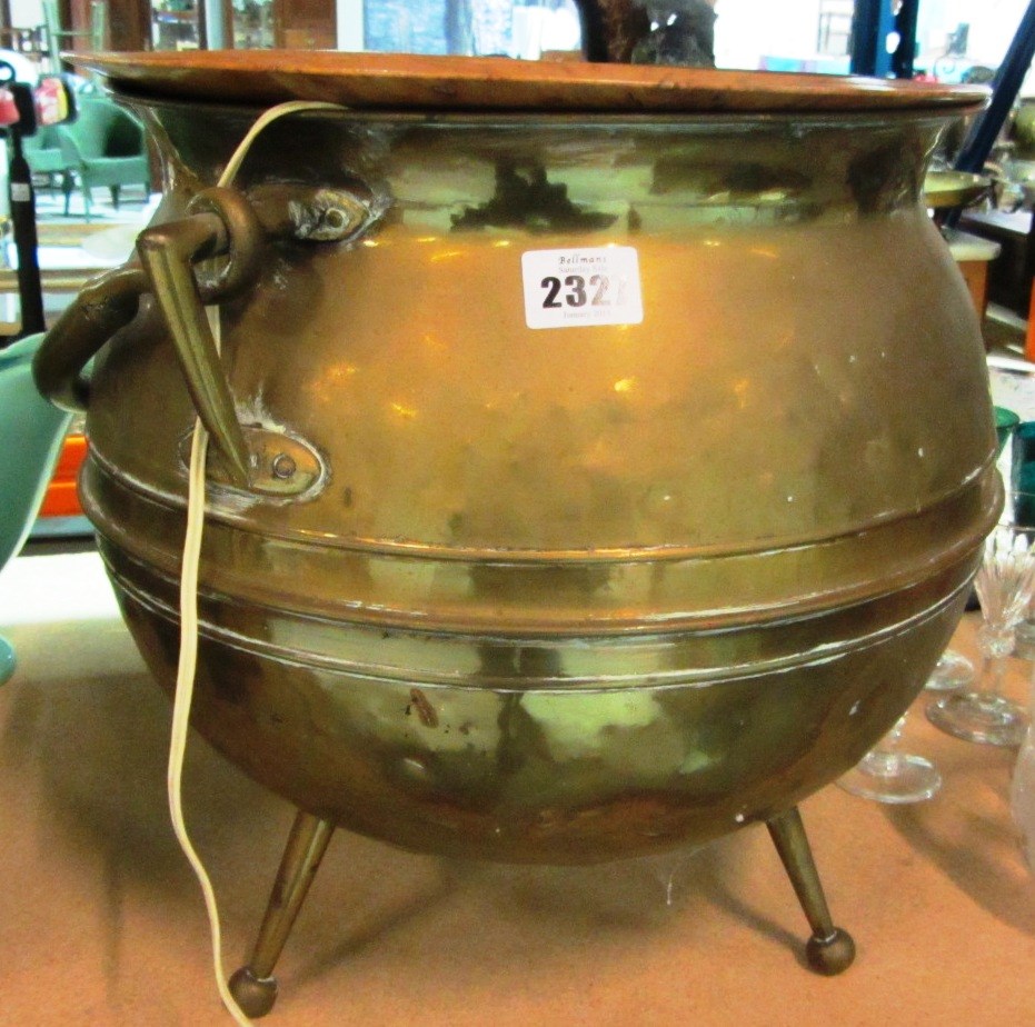 Appraisal: A copper cauldron a wooden plate and sundry