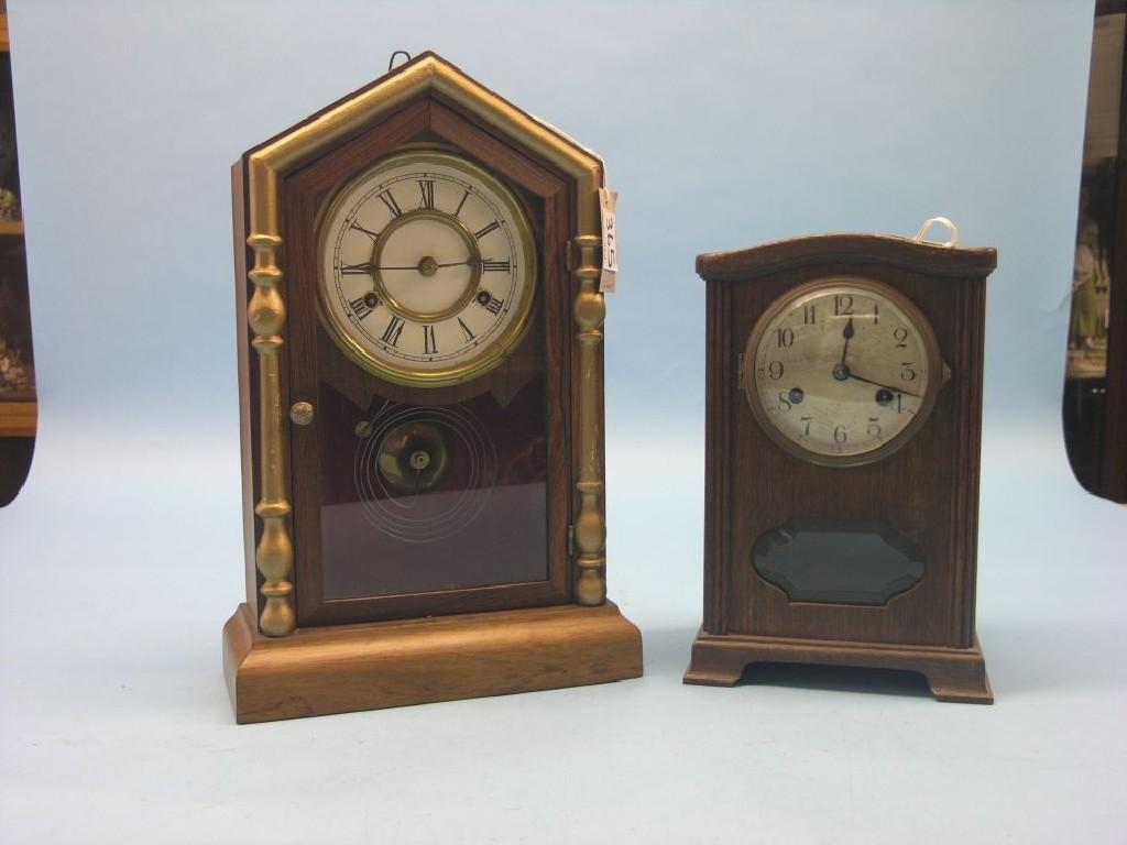 Appraisal: A New Haven Clock Company mantel clock featuring arched glazed