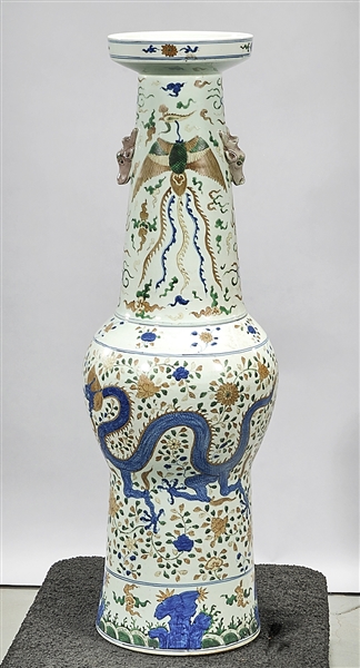 Appraisal: Tall Chinese enameled porcelain vase depicting dragons phoenix and flowers