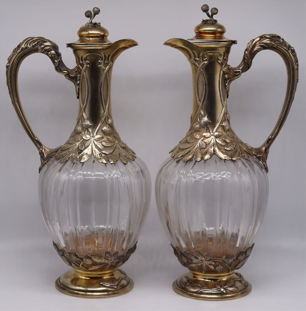 Appraisal: SILVER Pair of French Silver Mounted Claret Jugs Art Nouveau