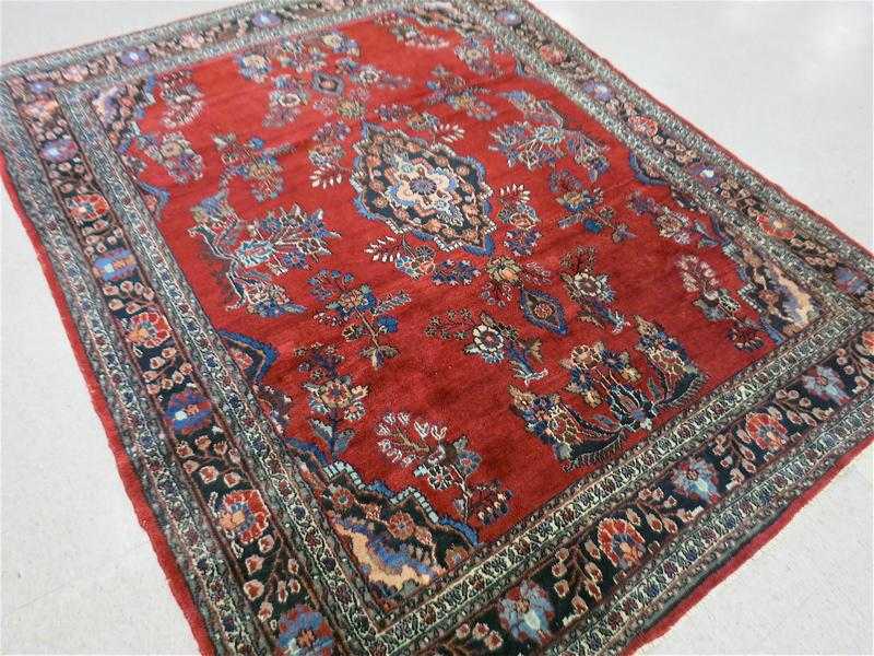 Appraisal: SEMI-ANTIQUE PERSIAN CARPET Hamadan region central medallion floral sprig design