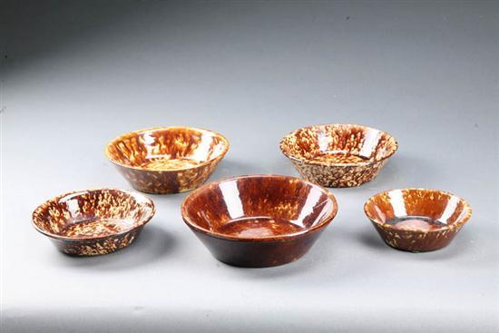 Appraisal: FIVE GRADUATED ROCKINGHAM BOWLS American mid th century ceramic Shallow