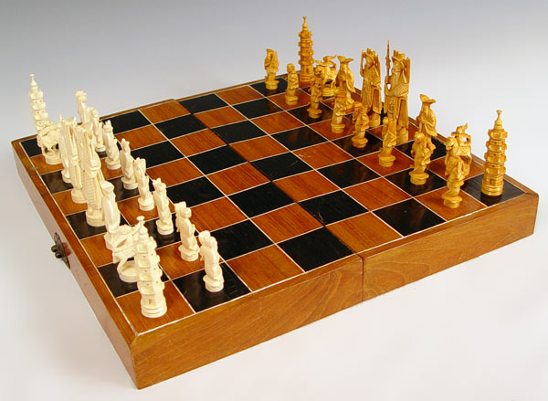 Appraisal: CHINESE CARVED IVORY CHESS SET Complete set King measures ''