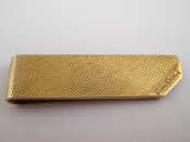 Appraisal: A gilt metal tests silver money clip signed Pierre Cardin