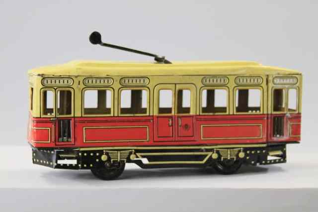 Appraisal: GUNTHERMANN TROLLEY Germany lithographed tin done in red and yellow