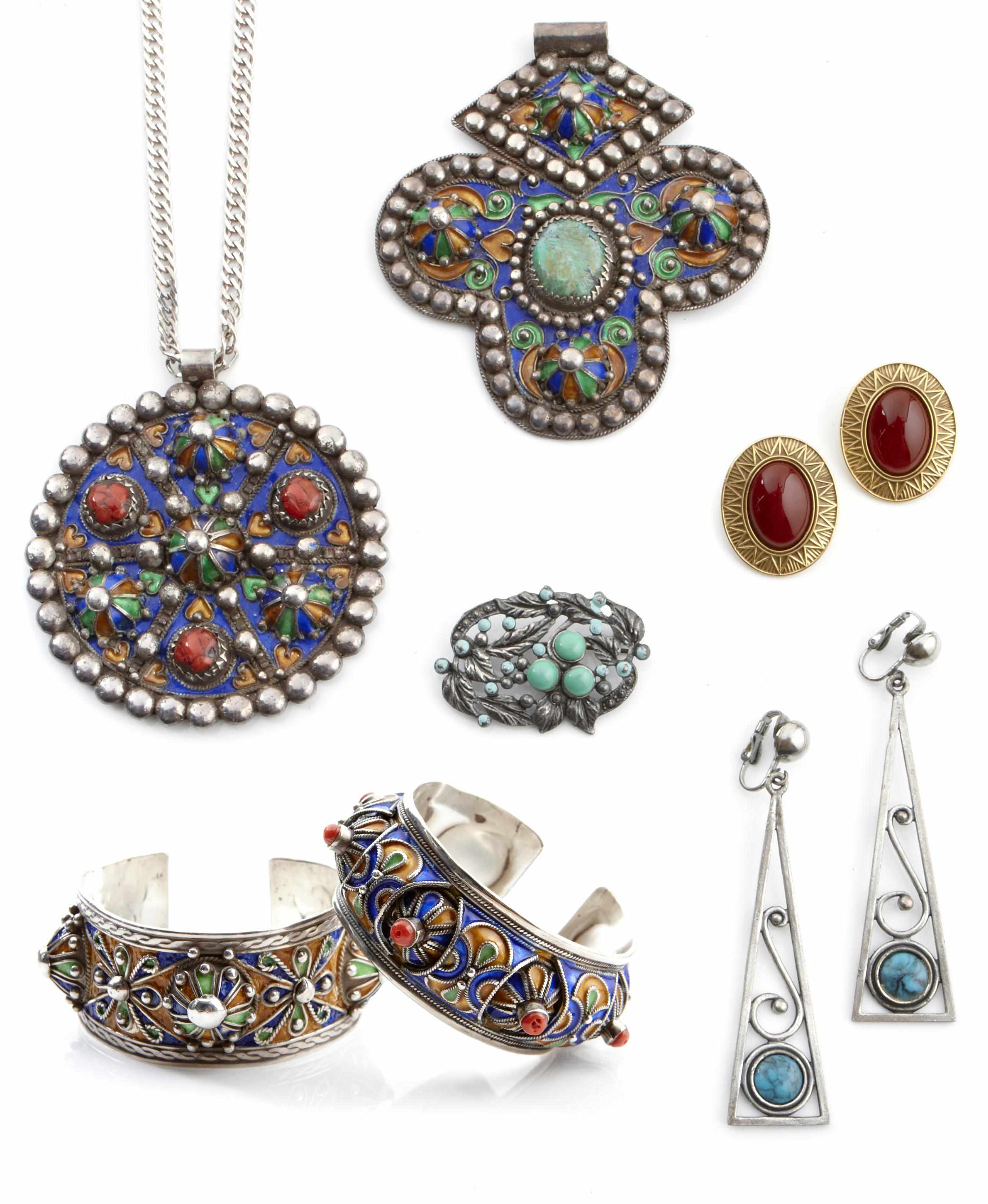 Appraisal: A collection of ivory hardstone silver and metal jewelry