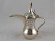 Appraisal: A Persian style silver coffee jug with long spout C