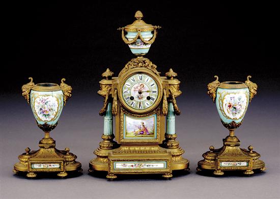 Appraisal: French ormolu and porcelain clock garniture circa garland and ribbon-encrusted