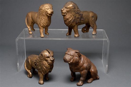 Appraisal: Three cast iron lion-form still banks and similar bull dog