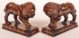 Appraisal: Pair of Rockingham Glazed Earthenware Lions Pair of th Century