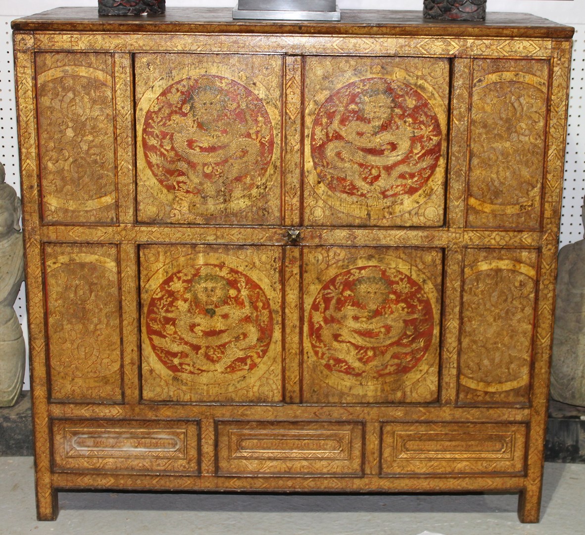 Appraisal: A th century Chinese red lacquer gilt decorated side cabinet