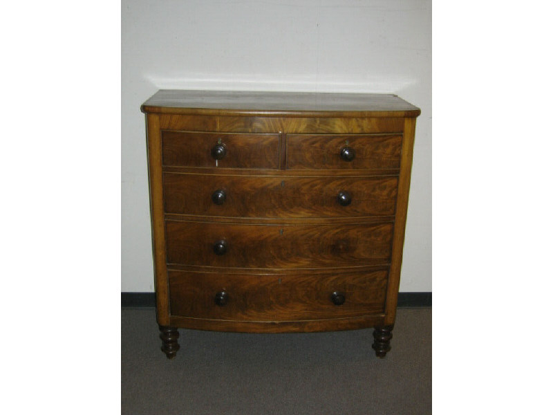 Appraisal: ENGLISH VICTORIAN FLAME FIGURED MAHOGANY CHEST The bowed front with