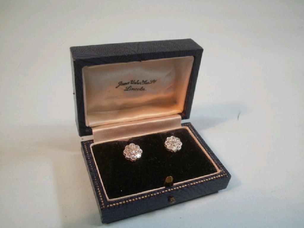 Appraisal: A pair of diamond cluster earrings