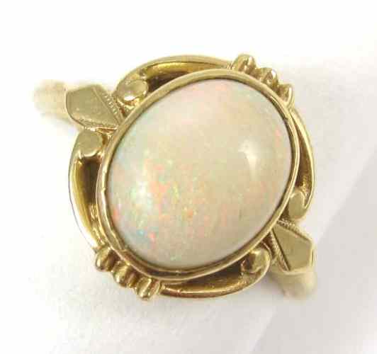 Appraisal: OPAL AND FOURTEEN KARAT GOLD RING set with a single