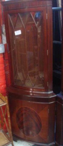 Appraisal: Georgian Style Mahogany Corner Cabinet With oval banded center panel