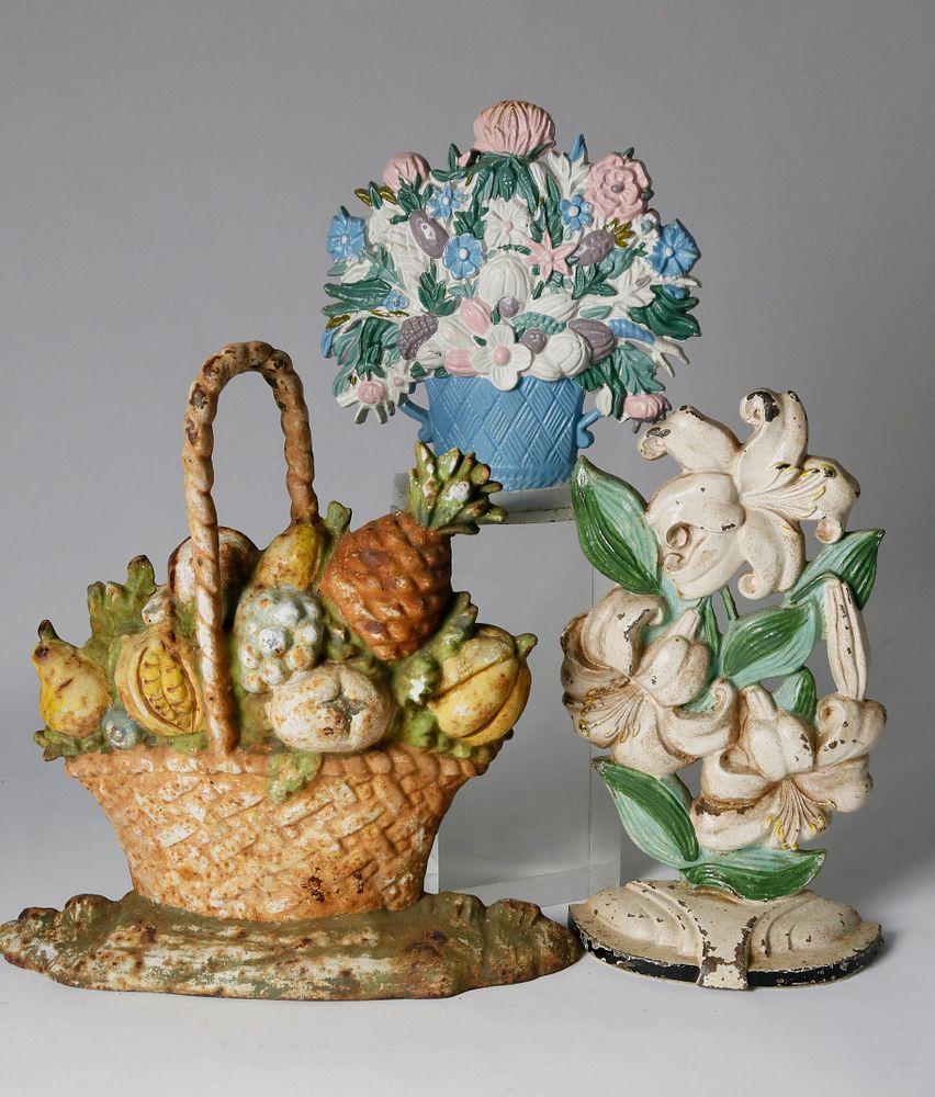 Appraisal: Collection of Flower Basket Cast Iron Doorstops Collection of Flower