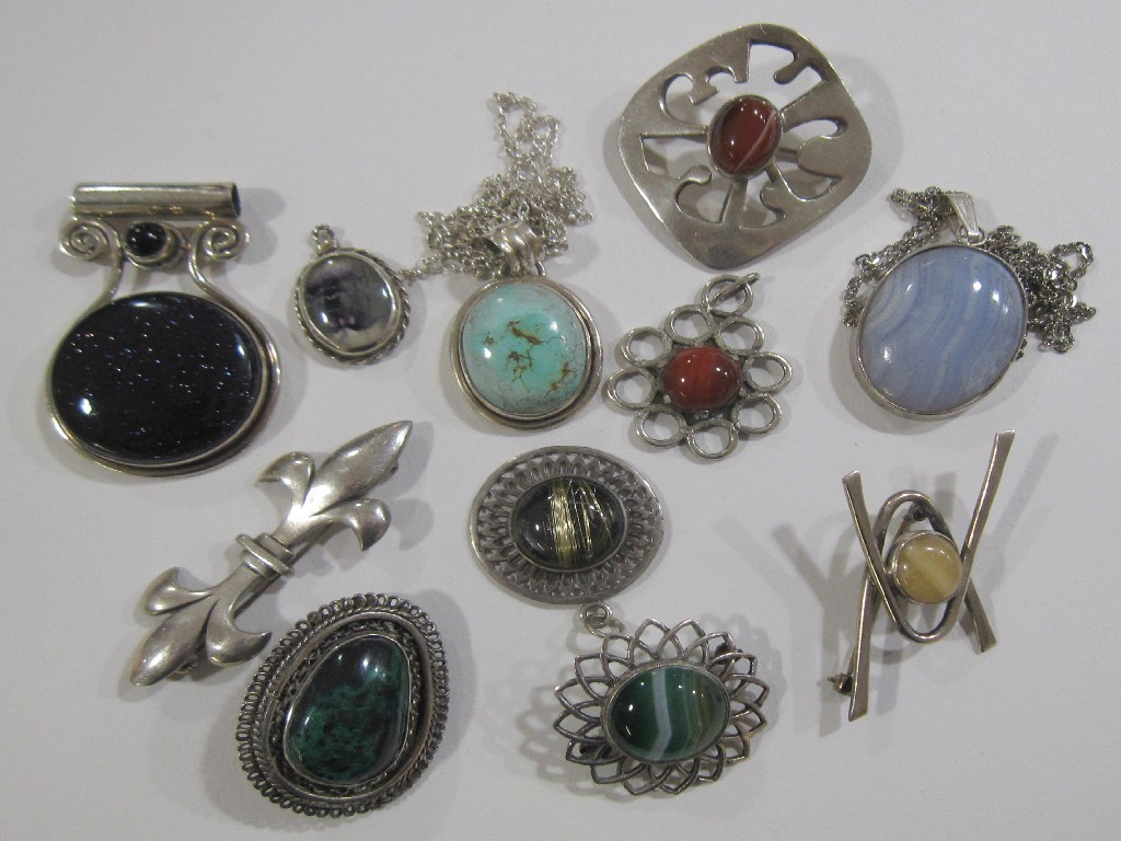 Appraisal: Lot comprising three banded agate set silver brooches malachite set