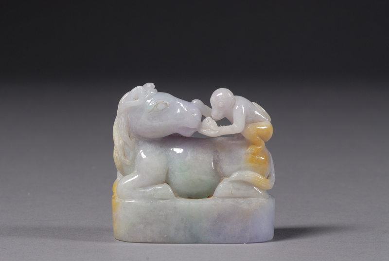 Appraisal: Jadeite Carving depicting a horse with a monkey stone of