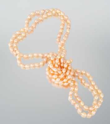 Appraisal: A Rope Length Peach Color Pearl Necklace One long rope