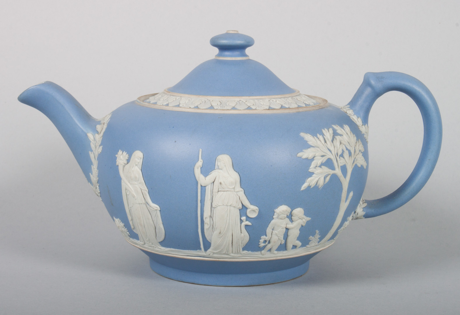 Appraisal: Wedgwood jasperware teapot first quarter- th century white relief images