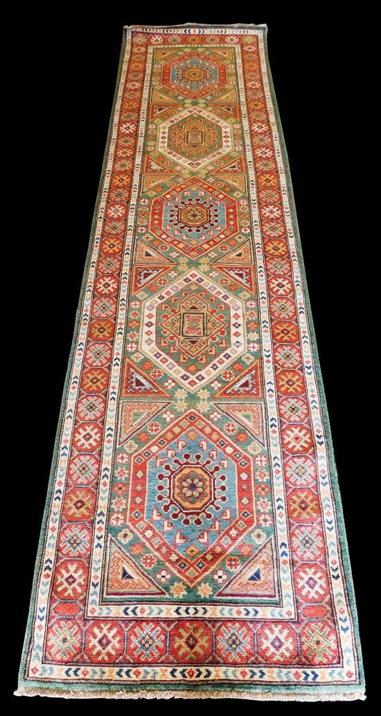 Appraisal: RUG Uzbek kazak runner ' x ' jade field with