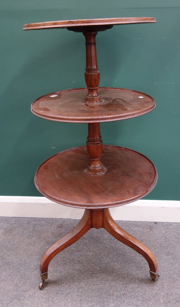 Appraisal: A Regency mahogany graduated circular three tier dumb waiter on