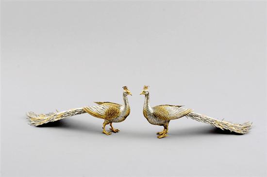 Appraisal: Pair sterling peacocks th century peacocks standing regally with raised