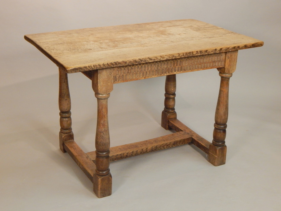 Appraisal: A small oak refectory type table the rectangular top above