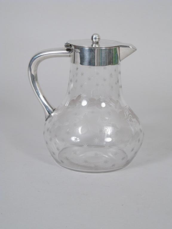 Appraisal: A Victorian silver mounted Claret Jug with hinged cover the