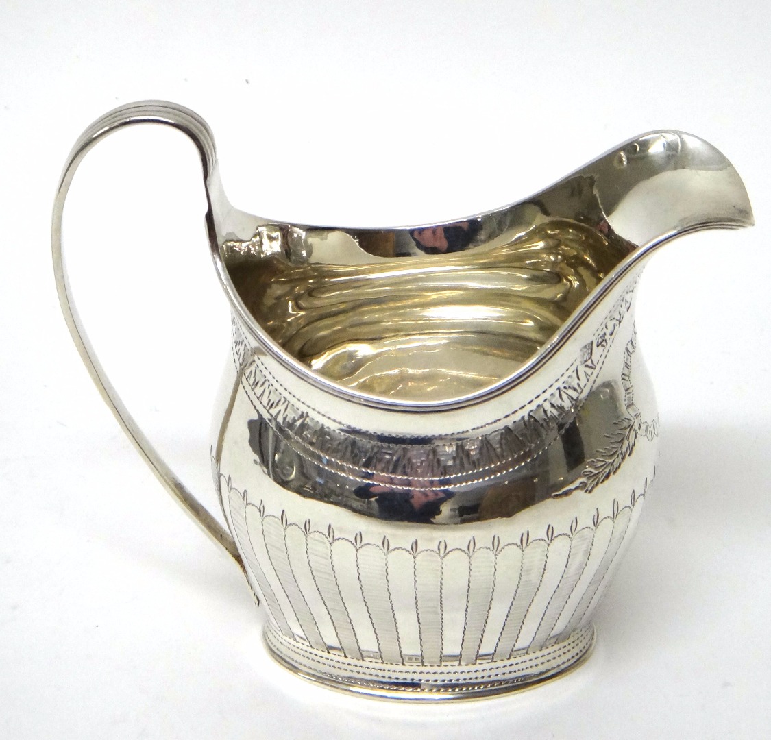 Appraisal: A George III silver helmet shaped milk jug with engraved