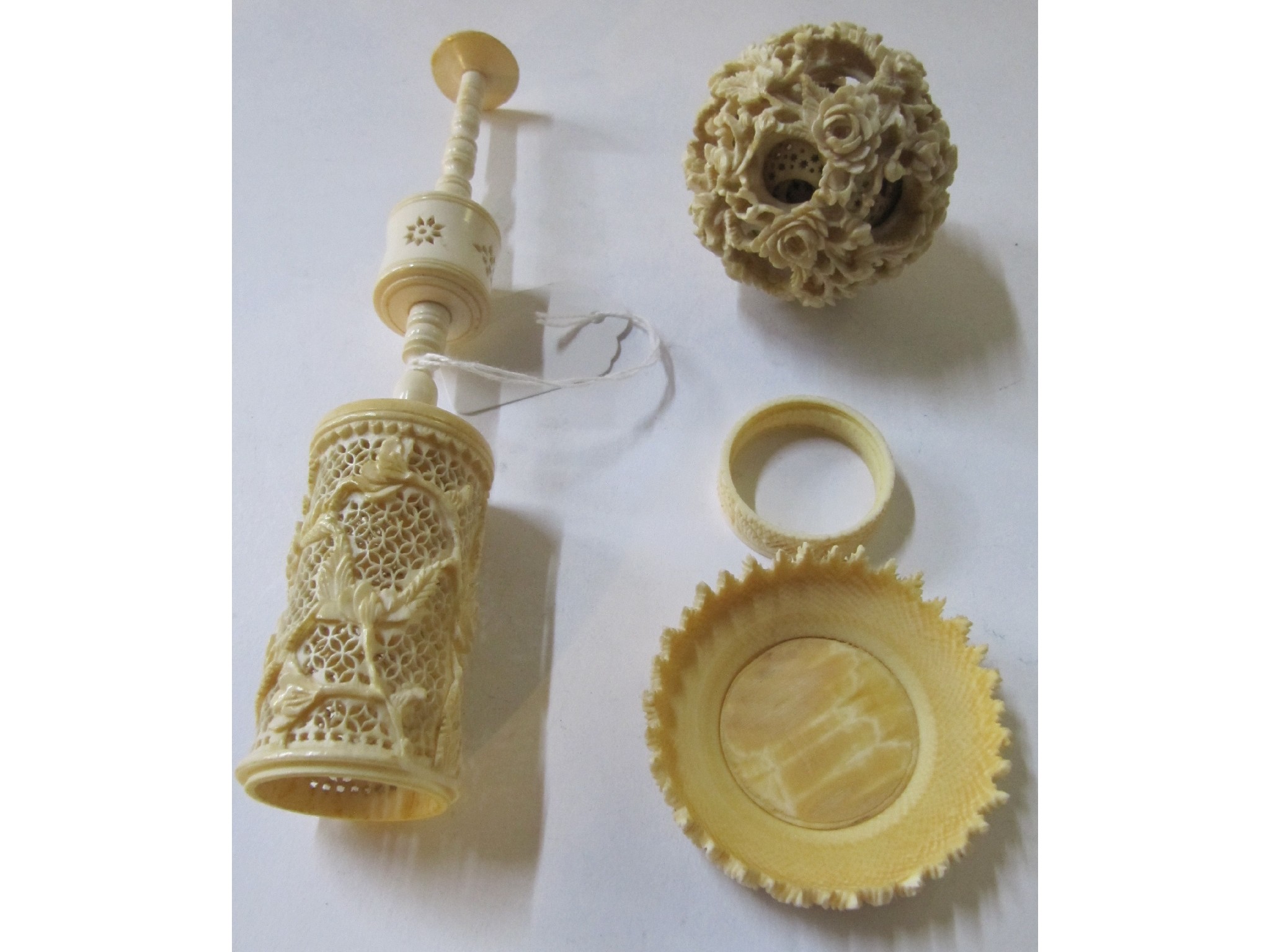 Appraisal: A carved ivory puzzle ball with stand