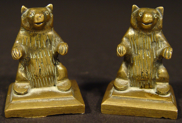 Appraisal: Two brass bear weights on stepped bases each cm high