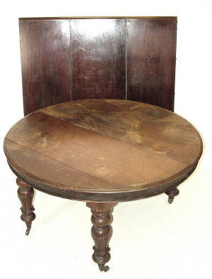 Appraisal: A mahogany dining table late th century the rounded moulded