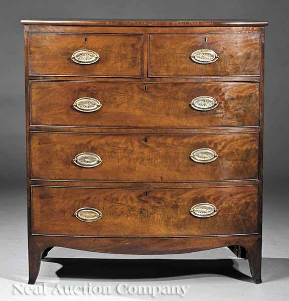 Appraisal: An Antique Georgian-Style Mahogany Bowfront Chest c molded top two